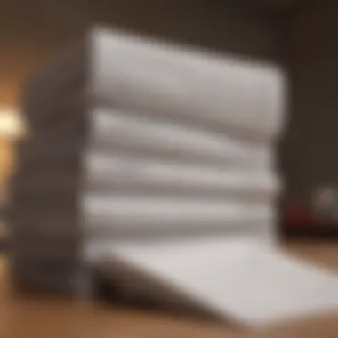 Legal Documents Representing Contractual Obligations Legal documents and contracts stacked on a table